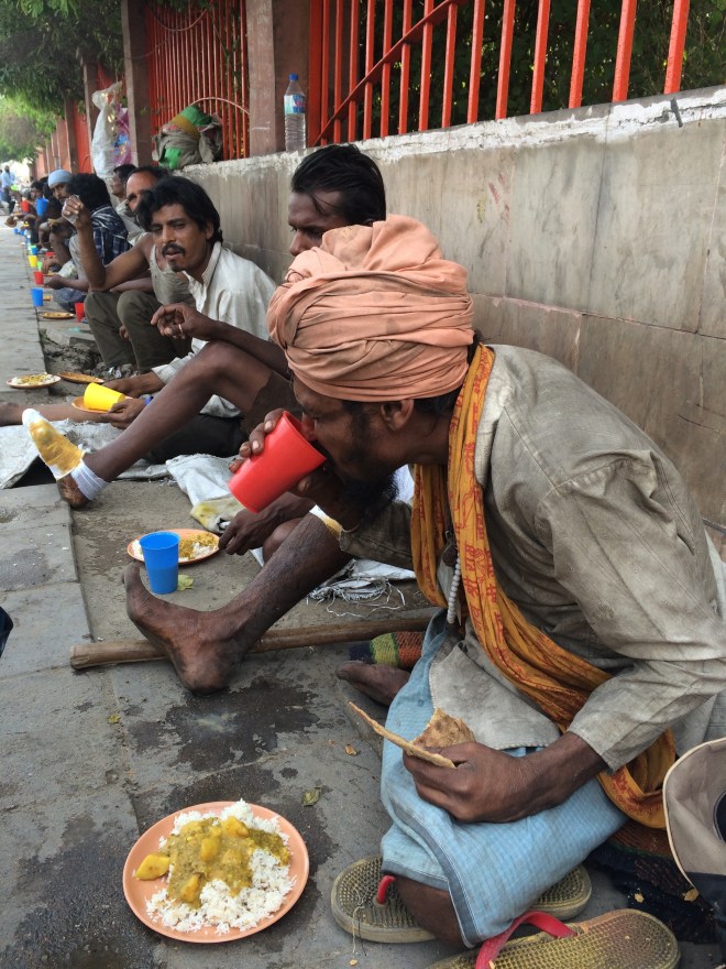 Migrant worker in New Delhi, eating his breakfast